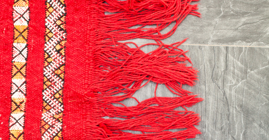 an image of red knitted rug in an RV­