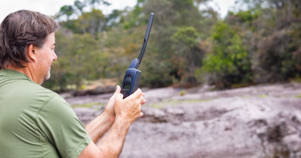 Man using satellite phone in the outback